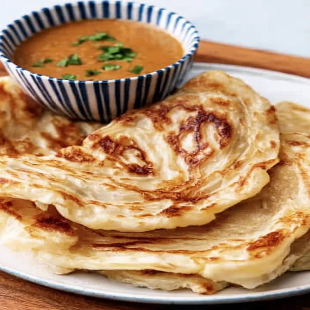 flaky roti canai, Malaysian cuisine, crispy, savory, delicious, recipe