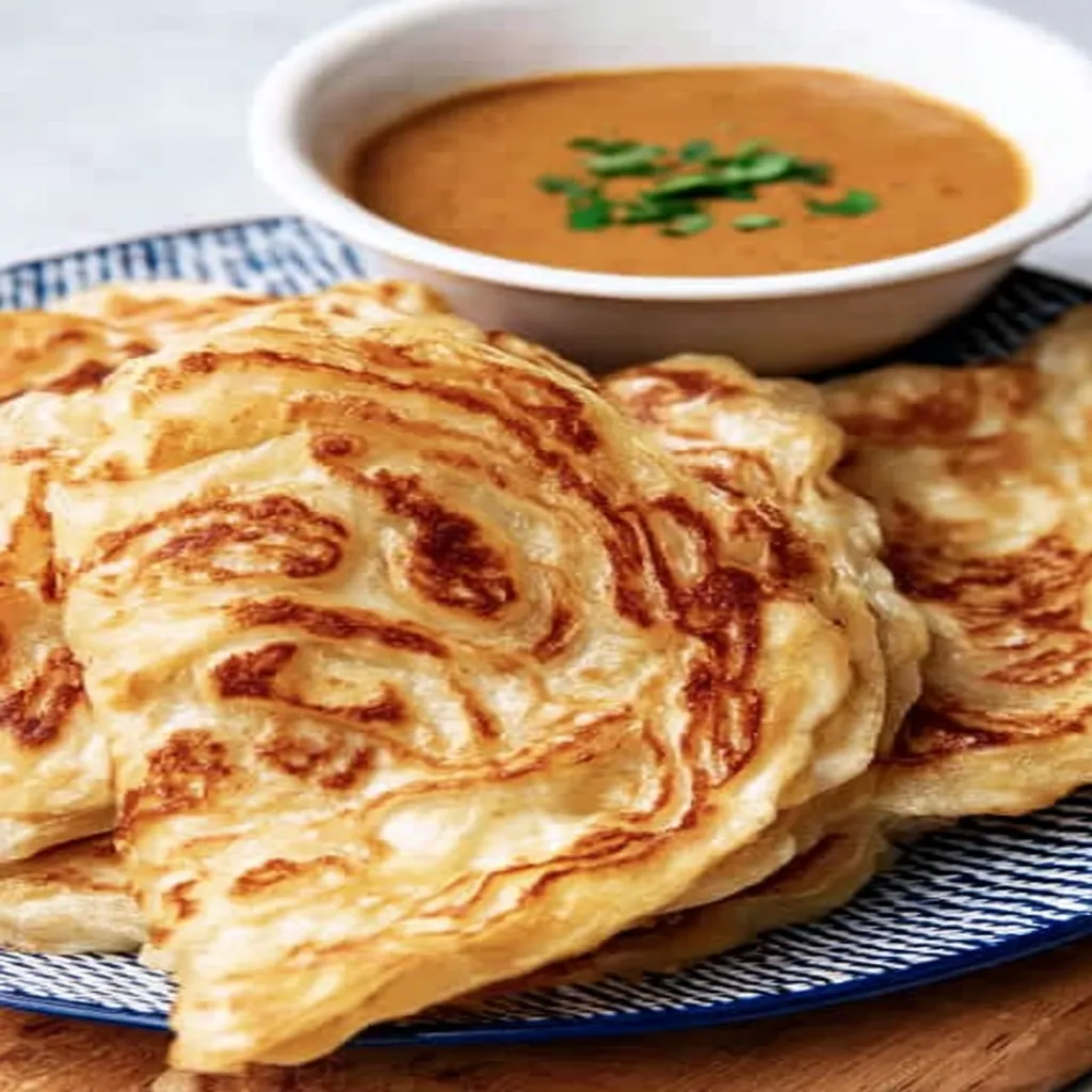 flaky roti canai, Malaysian cuisine, crispy, savory, delicious, recipe