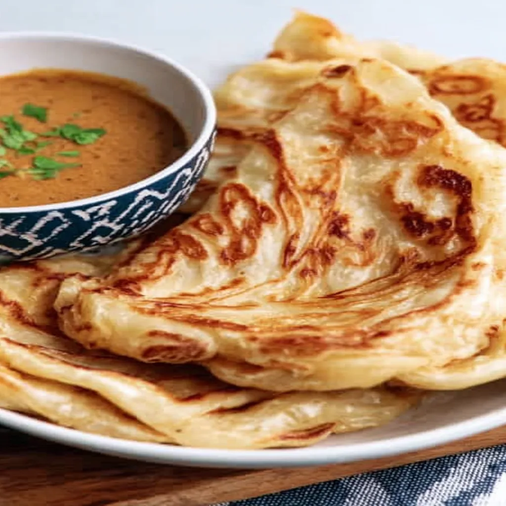 flaky roti canai, Malaysian cuisine, crispy, savory, delicious, recipe