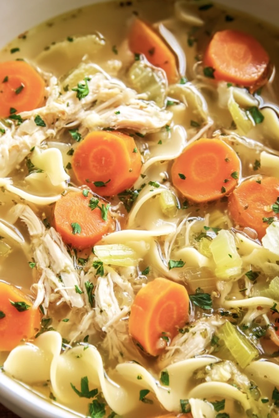 chicken noodle soup, comforting, savory broth, hearty vegetables, steaming bowl