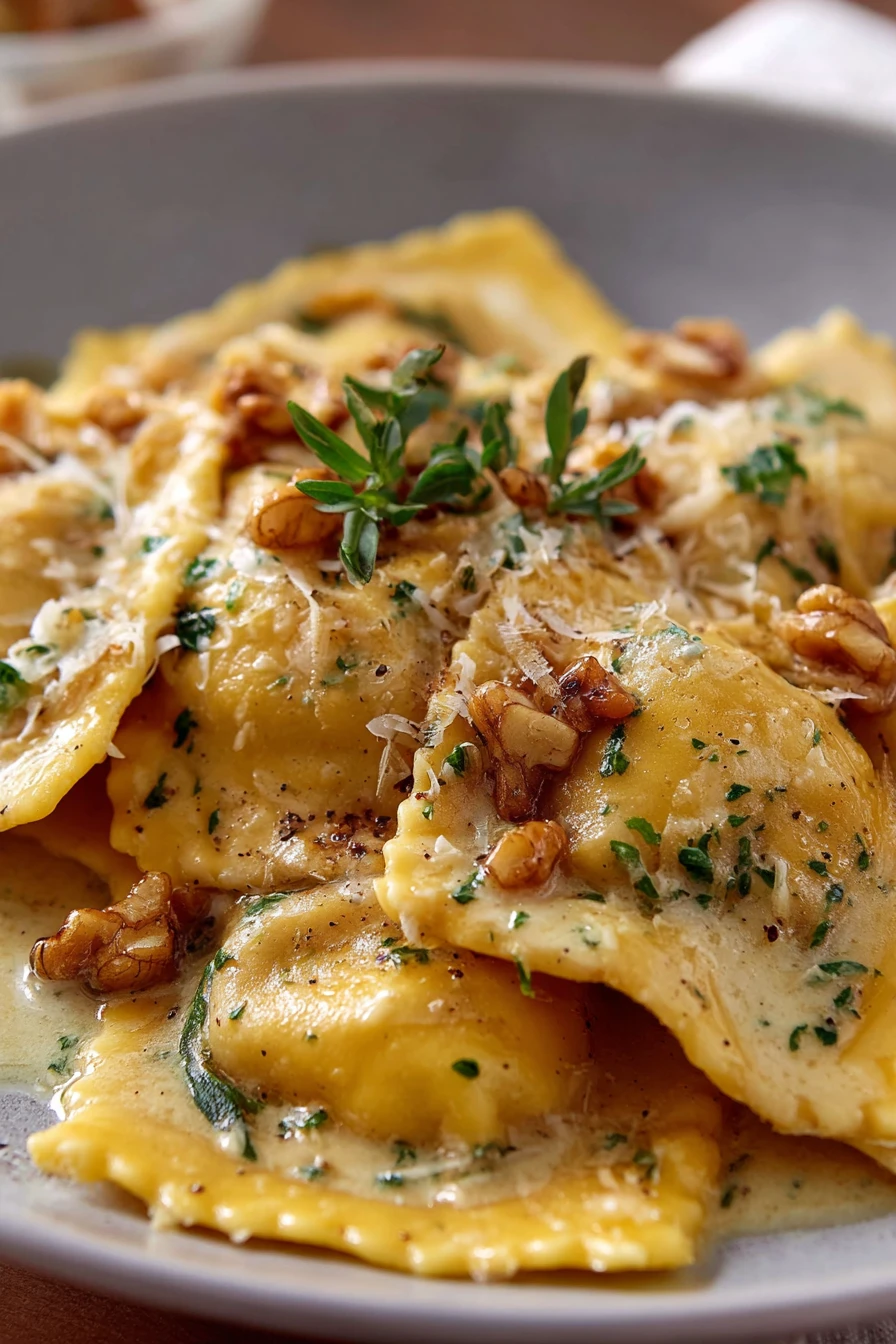 butternut squash ravioli, brown butter sauce, savory, delicious, pasta dish, flavorful sauce